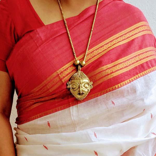 Handmade Dokra Man-face Pendant set on brass beads