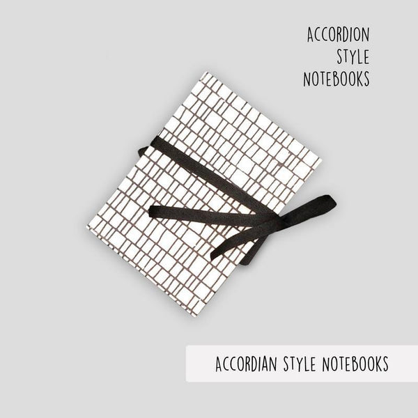 White Accordion Style Handmade Paper Journal with Black Lines (4 sets of 18 pages each)